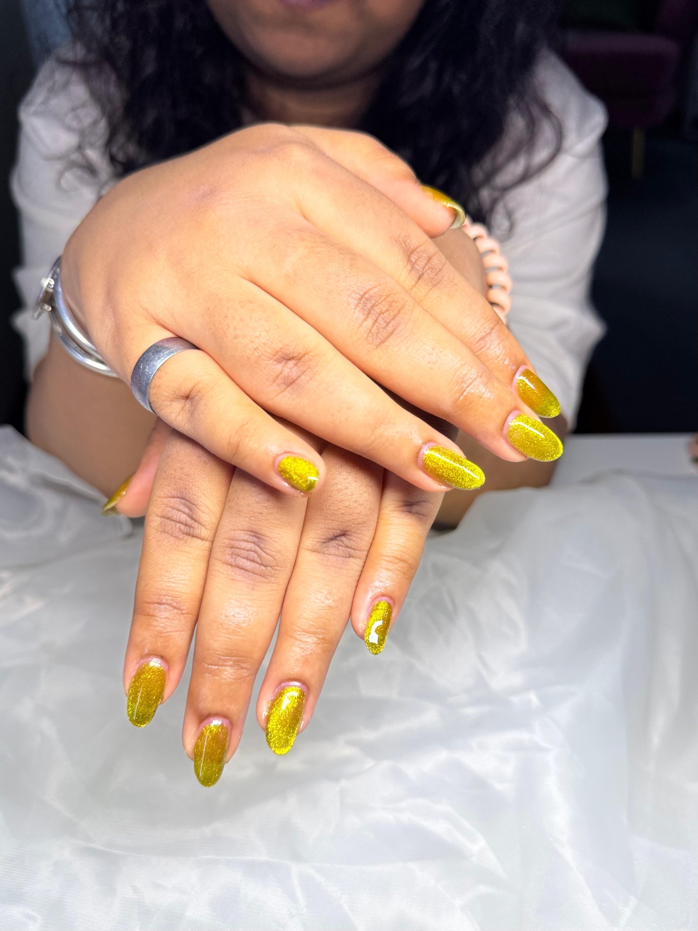 Gold glitter nail design by Bella’s Nail Studio